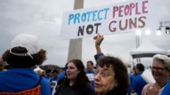 "Protect people not guns" - a sign at a rally in Washington
