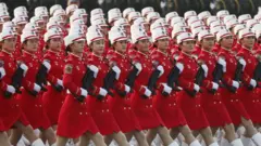 Chinese women troops march during a military parade in Tiananmen Square in Beijing on 1 October 2019 marking the 70th anniversary of the founding of the People's Republic of China.
