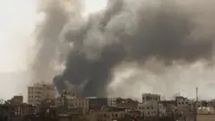 Smoke billows from the scene of Saudi-led coalition air strikes in Sanaa, Yemen (7 March 2021)