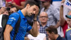 Novak Djokovic walks off court after retiring injured against Stan Warinka