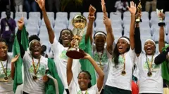 Nigeria D'Tigress team players celebrate as dem win Women Afrobasket Cup 2019