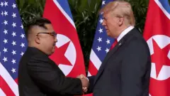 Kim Jong-un and Donald Trump shaking hands