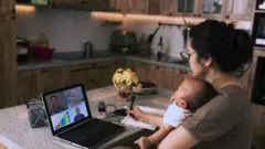 mom holding her baby