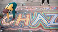 "Welcome to Chaz" is written in spray paint in Seattle