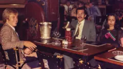 Eamonn O'Keefe, Prince Abdullah bin Nasser, and his wife in a London restaurant in 1976