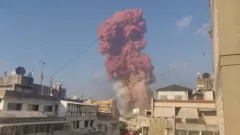 A red cloud of smoke is seen after the explosion in Beirut