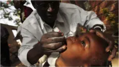 Boy being vaccinated against polio