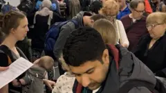 Passengers waiting at O'Hare airport
