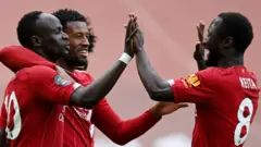 Sadio Mane ceebrates opening the scoring for Liverpool