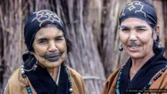 The Ainu were assimilated into Japanese society and their traditional tattoos and other customs banned