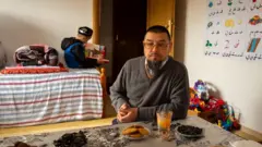 Abu Bakker Qassim at his home in Tirana. "This is not freedom," he said.