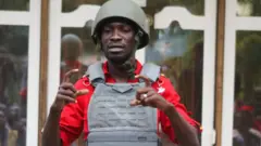 Bobi Wine wear military protection wit