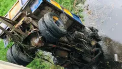 Truck wey dem dey comot from water