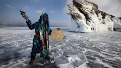 A shaman performing rituals on Siberia's frozen Lake Baikal