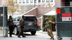 Hennepin County Sheriff Deputies and the US Army National Guard help secure the Hennepin County Government Center during closing arguments for former Minneapolis Police officer Derek Chauvin"s murder trial at the Hennepin County Government Center, in Minneapolis, US, on 19 April 2021