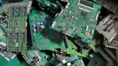 Discarded microchips at the Megapolisresurs recycling plant for household batteries, automotive batteries, and other disposed electronic products