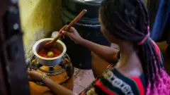 Femme qui cuisine