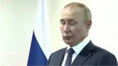путін