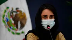 An "Afghan Dreamer" is seen during a press conference in Mexico City