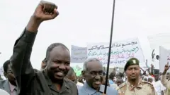 Harun (left) in 2010 when he was governor of the South Kordofan region