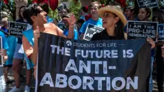Pro-life protesters stand near the gate of the Texas state capitol at a protest outside the Texas state capitol on 29 May 2021 in Austin, Texas