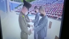 Footage obtained by BBC Korean show two 16-year-old boys handcuffed in front of hundreds of students at a park