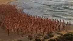 People pose naked on Bondi Beach, Australia