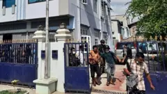 A military handout photograph shows soldiers and police arrested people during a raid in Mandalay