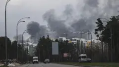 Smoke is seen rising over Darnytskyi District of Kyiv, Ukraine