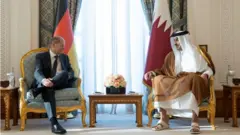 المستشار الألماني وأمير قطر