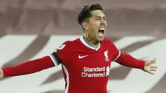Roberto Firmino celebrates his winner against Tottenham
