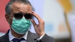Tedros Adhanom Ghebreyesus adjusts his glasses during a meeting with Doctors for Extinction Rebellion in May