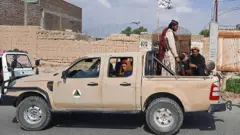 Taliban fighters in Laghman province on 15 August 2021