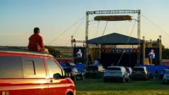 Customers in the opening night of Britain's first ever drive-in circus