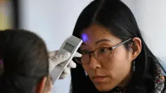 Woman being screened at Guatemala airport