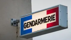 A picture shows the Gendarmerie logo in Ouistreham, north-western France