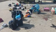 হামলার পর রেল স্টেশনে পড়ে থাকা লাগেজ।