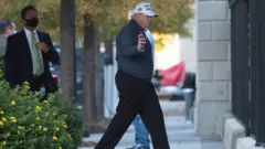 Trump arrives back at the White House after playing golf