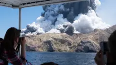 Tourist take pictures of the White Island eruption