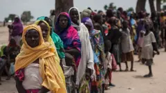 People queuing for aid