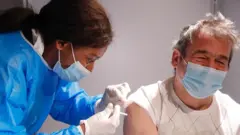 Man getting vaccine in Brussels