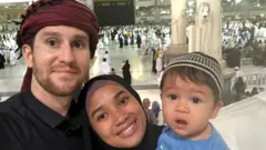 Dan with his wife and child in Mecca