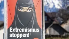 A poster promoting "Yes to the burka ban" is seen in Oberdorf, in the canton of Nidwalden, Switzerland, 16 February 2021
