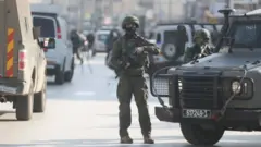 Security measures increased after a Palestinian gunman shot dead two Israelis in the occupied West Bank