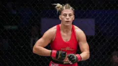 Kayla Harrison inside the cage