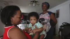 Felician Hurtado (right) with a mother whom she helped give birth