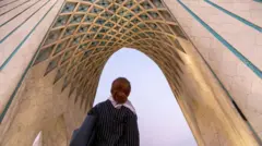 زنی در میدان آزادی تهران