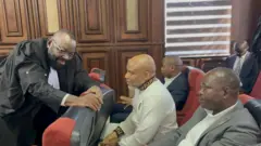 Aloy Ejimakor, one of Nnamdi Kanu lawyers, dey speak wit am for inside court room during di hearing of September 16 2025