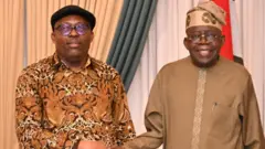 President Tinubu shakes hand wit Guvnor Sim Fubara