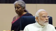 નરેન્દ્ર મોદી અને નિર્મલા સિતારમણ